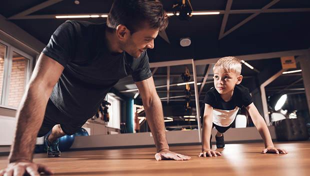 family home gym with father and son