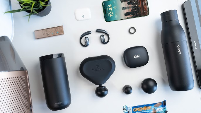 various tech accessories for fitness laid out on a white background