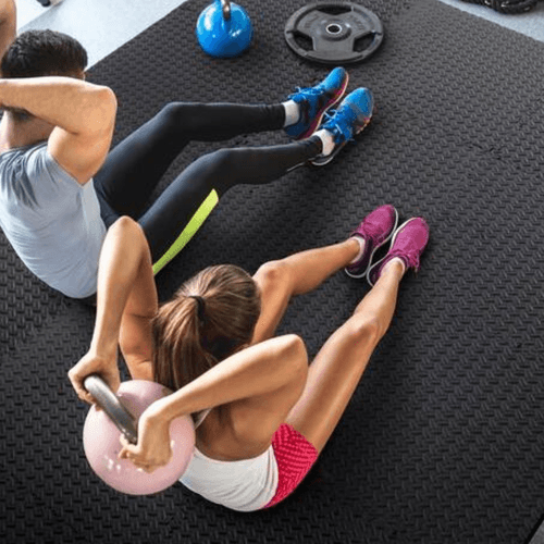 couple working out on EVA foam tiles